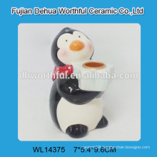 Handmade ceramic candle holder with penguin design